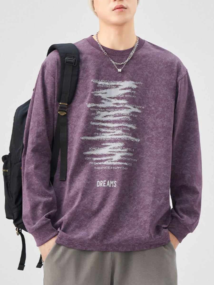 Purple oversized long-sleeve tee with graphic text print and "DREAMS" graphic.