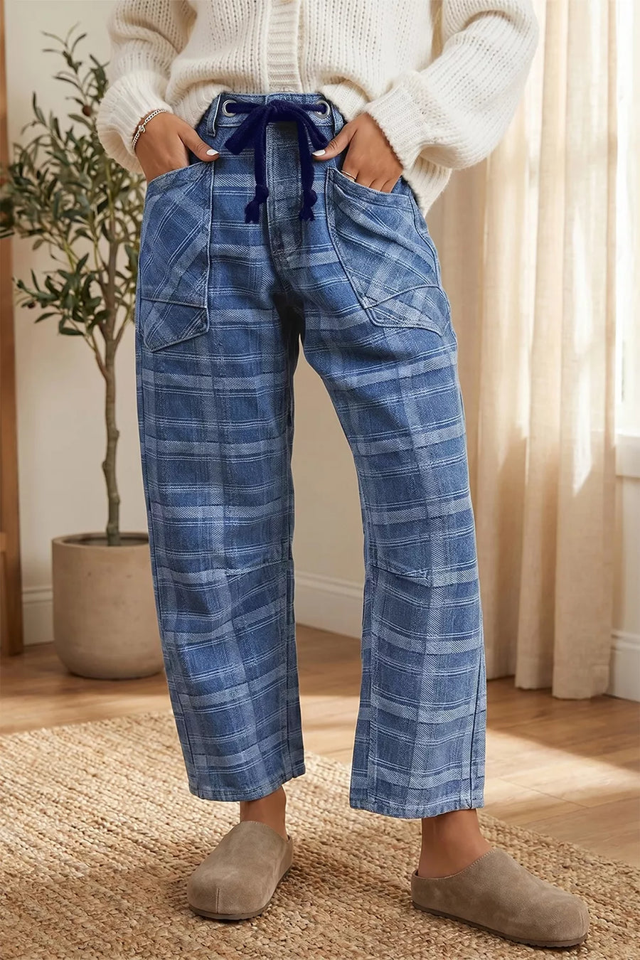 Plaid denim jeans with drawstring waist and grommets in dusty blue cotton.