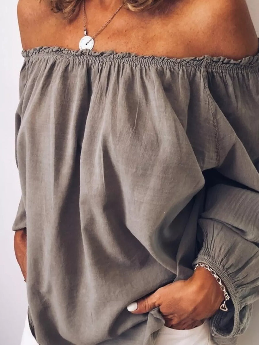 Gray off-the-shoulder maternity shirt with gathered neckline frill detail and long sleeves.