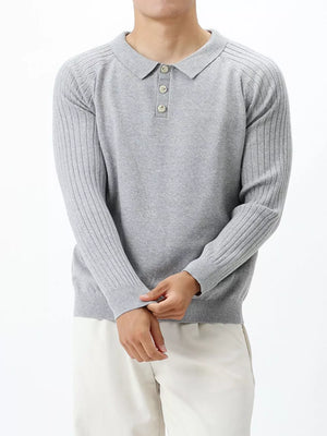 Light gray cotton knit polo shirt with ribbed sleeves and button placket.
