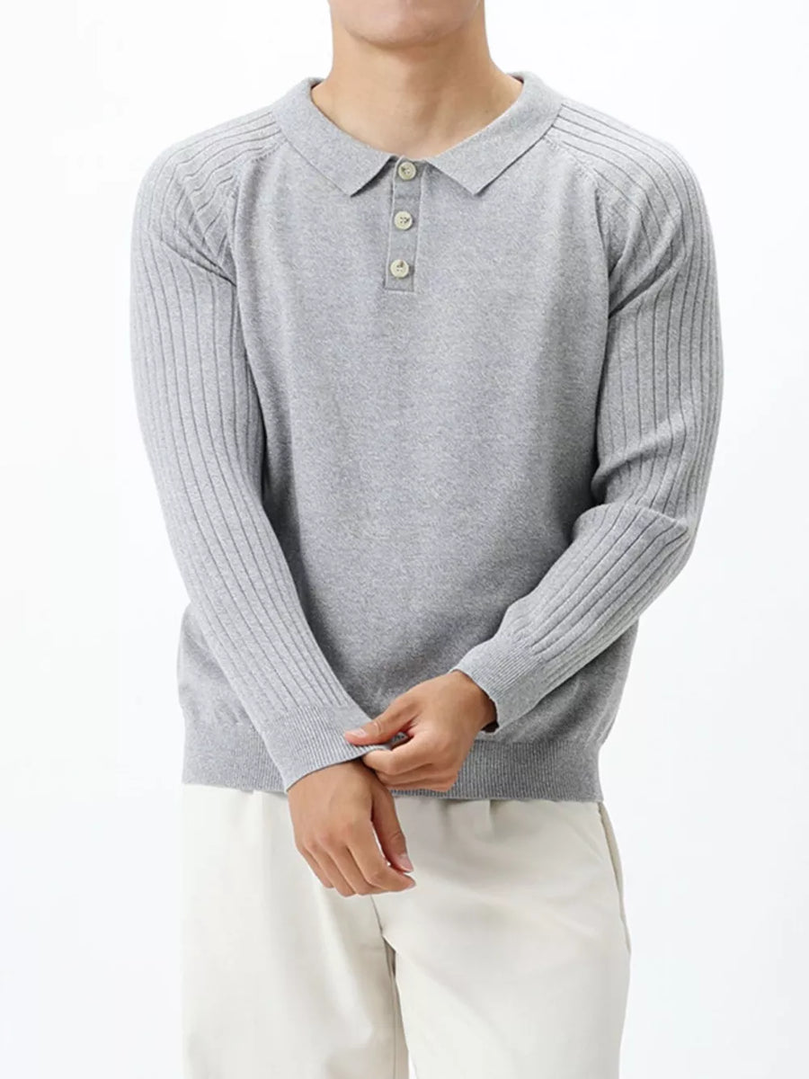 Light gray cotton knit polo shirt with ribbed sleeves and button placket.