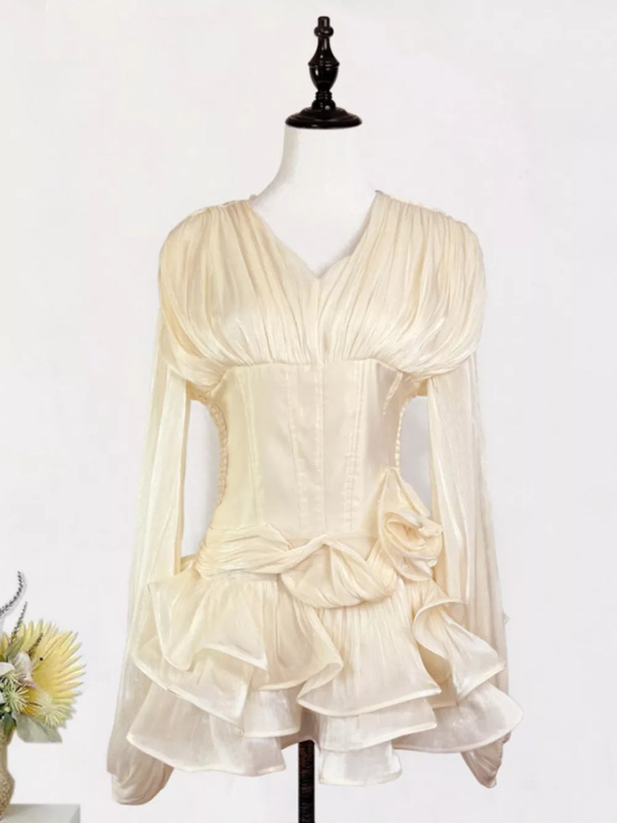 Apricot ruffled mini dress with corset waist, v-neck, long sleeves, and tiered skirt.