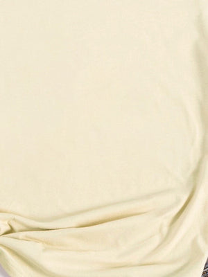 Light yellow oversized graphic tee with a soft cotton feel.