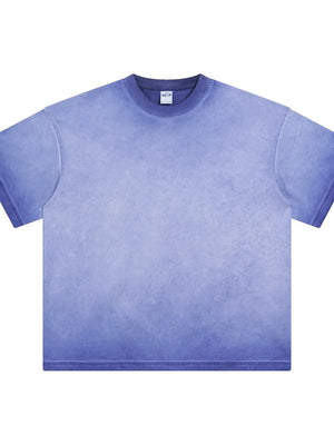 Pigment-dyed oversized tee in Light Indigo with a faded gradient effect and crew neck.