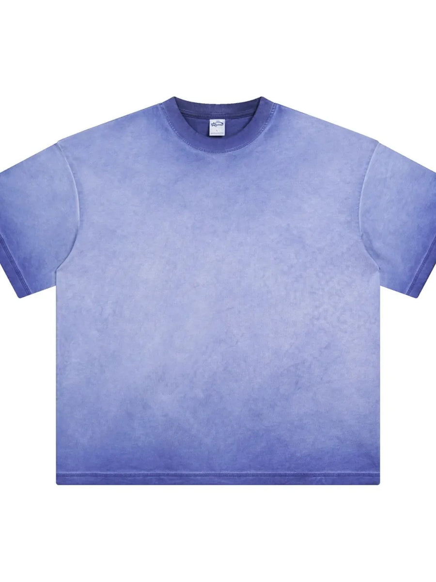 Pigment-dyed oversized tee in Light Indigo with a faded gradient effect and crew neck.