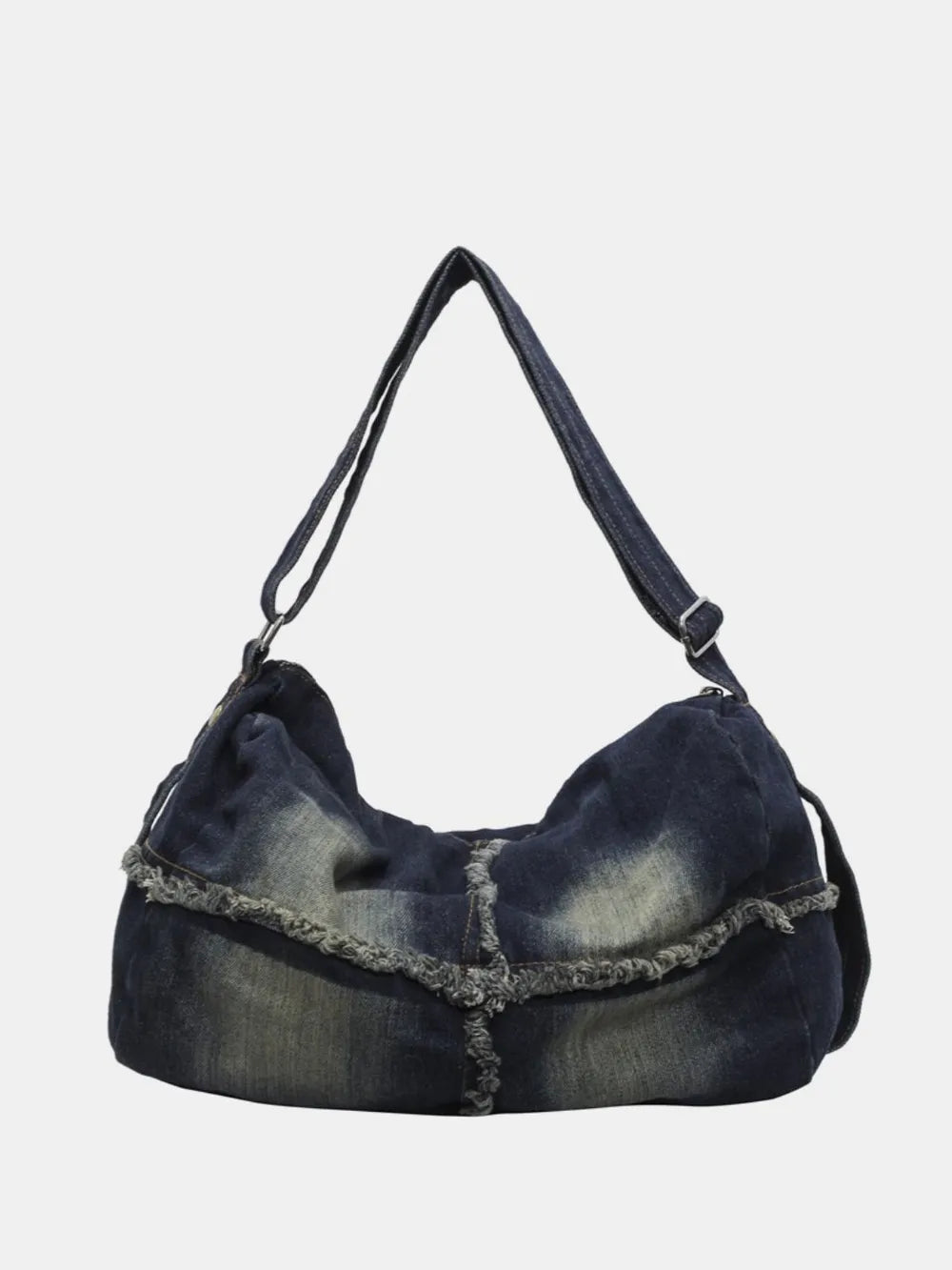 Dark wash denim slouch crossbody bag with frayed edges and adjustable strap.