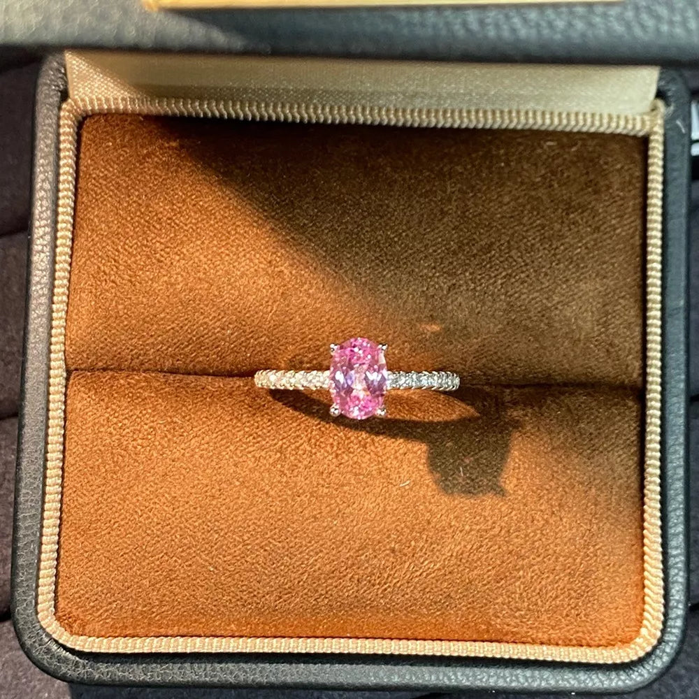 ring in pink featuring oval cut zircon and fitted fit