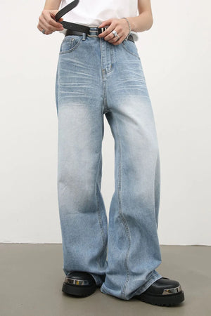 Light blue baggy denim palazzo jeans with a faded wash and wide leg.