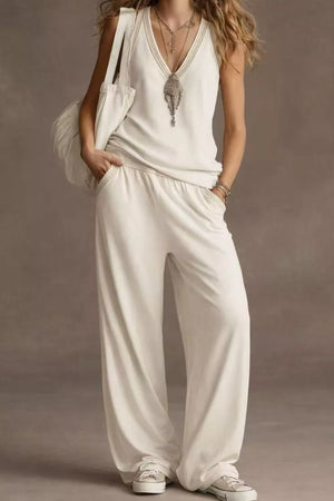 White V-neck tank top and wide-leg pants set with elastic waist and beaded trim.
