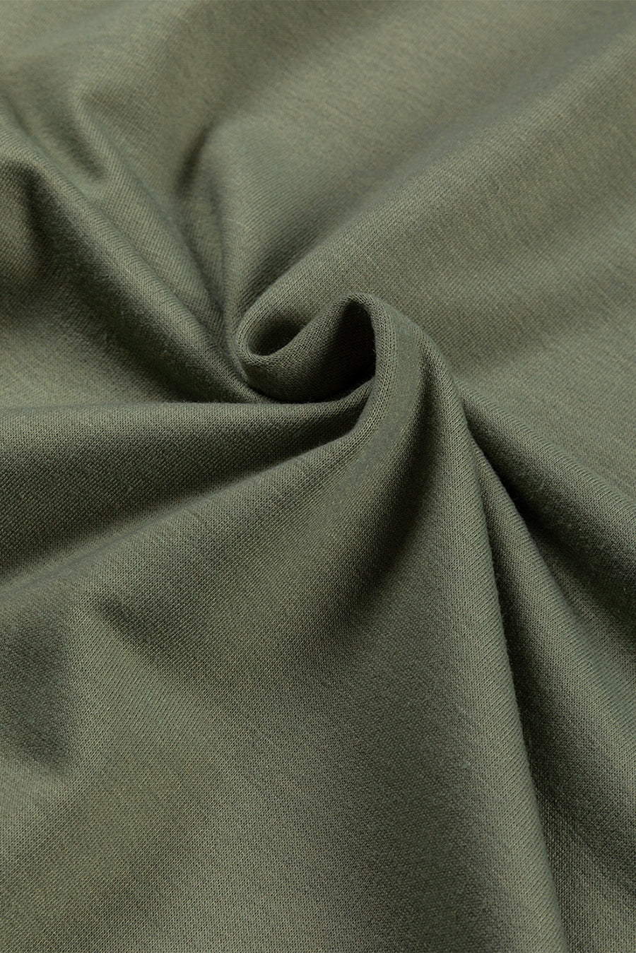 Army green tunic fabric with a textured weave and soft drape.