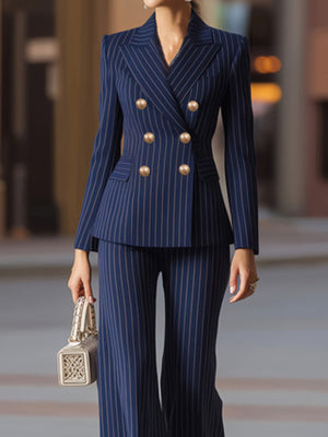 Navy pinstripe double-breasted blazer and wide-leg pants set with gold buttons.
