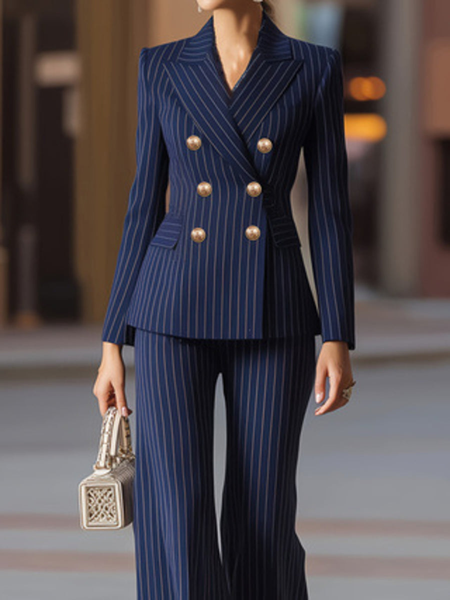 Navy pinstripe double-breasted blazer and wide-leg pants set with gold buttons.