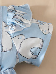 Sky blue baby dress with bunny applique and ruffled sleeves.