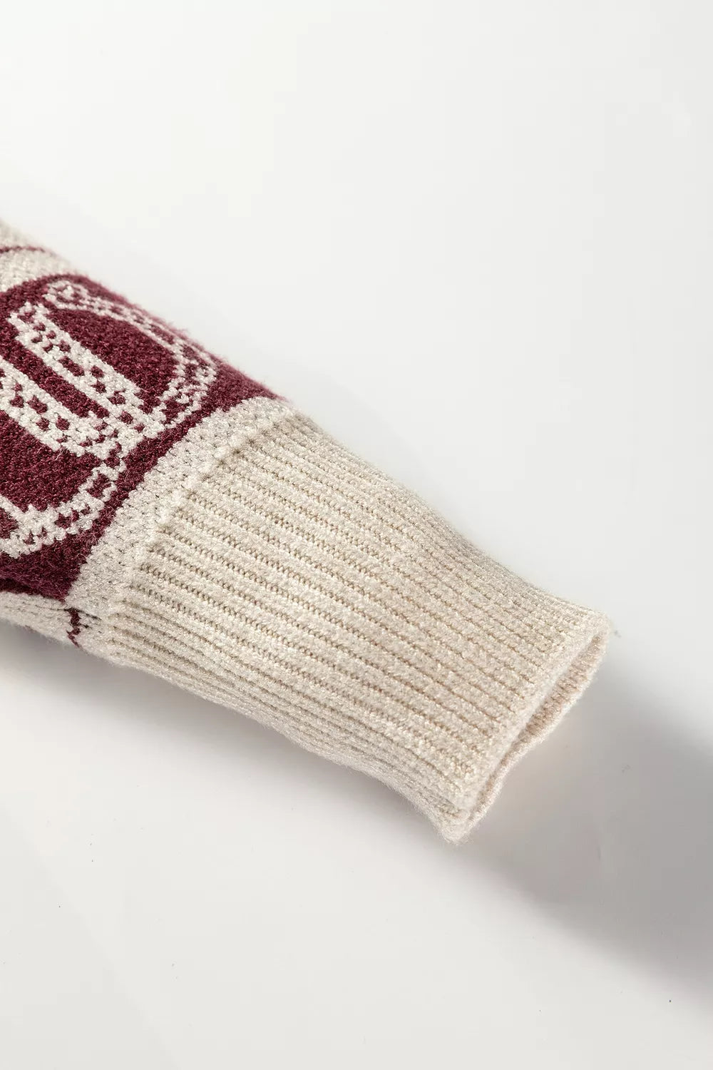 ivory pullover sweater with ribbed hem and long sleeve
