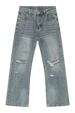 Distressed flare jeans in medium wash denim with raw-cut knee details.
