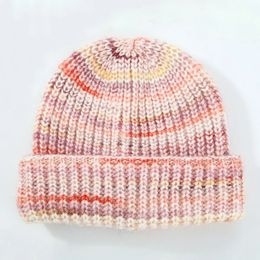 Textured mélange ribbed beanie in a multi-color knit with pink, orange, and yellow accents.