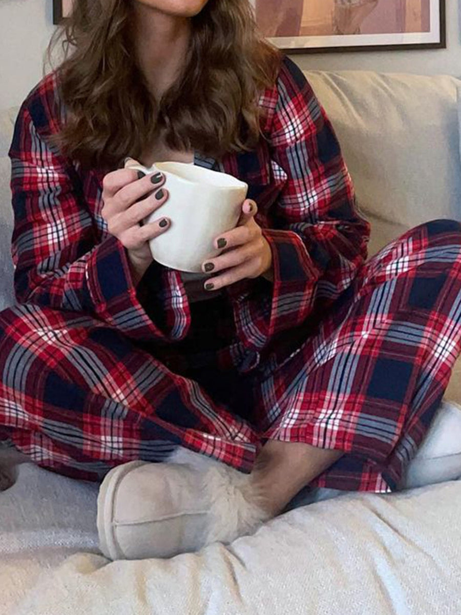 Crimson plaid pajama set with long sleeves and pants, made of polyester.