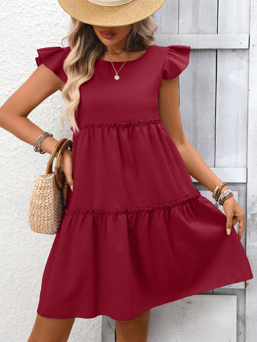 Wine red ruffled cap sleeve mini dress with tiered skirt and round neckline.