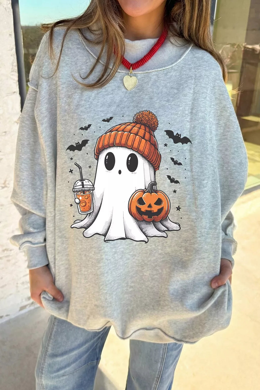 light gray sweatshirt with graphic-print and mock neck