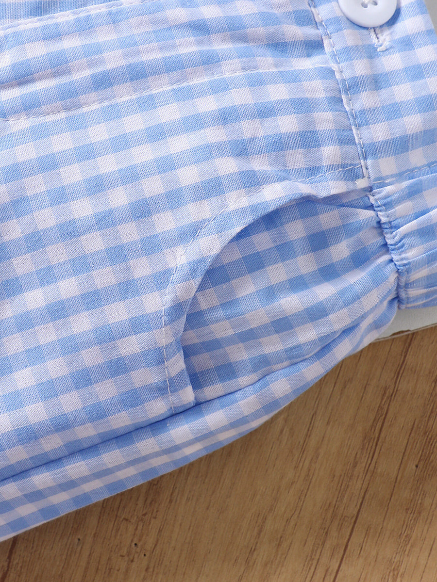 Blue gingham cotton shorts with a pocket detail and button closure.