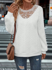White cable-knit sweatshirt with lace inset neckline and long sleeves.