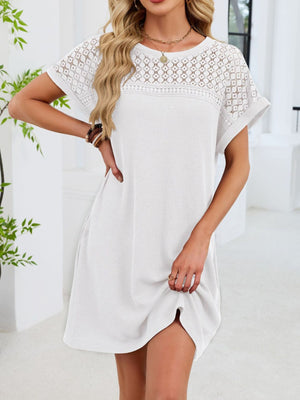 White t-shirt dress with short sleeves and sheer lace yoke detail, above knee length.