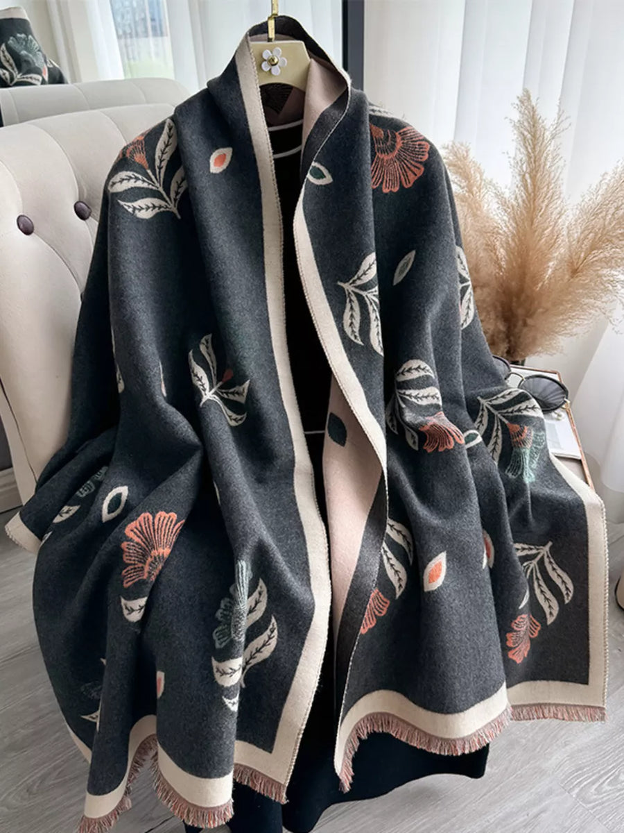 Gray floral print fringed shawl with cream trim and fringe detail.