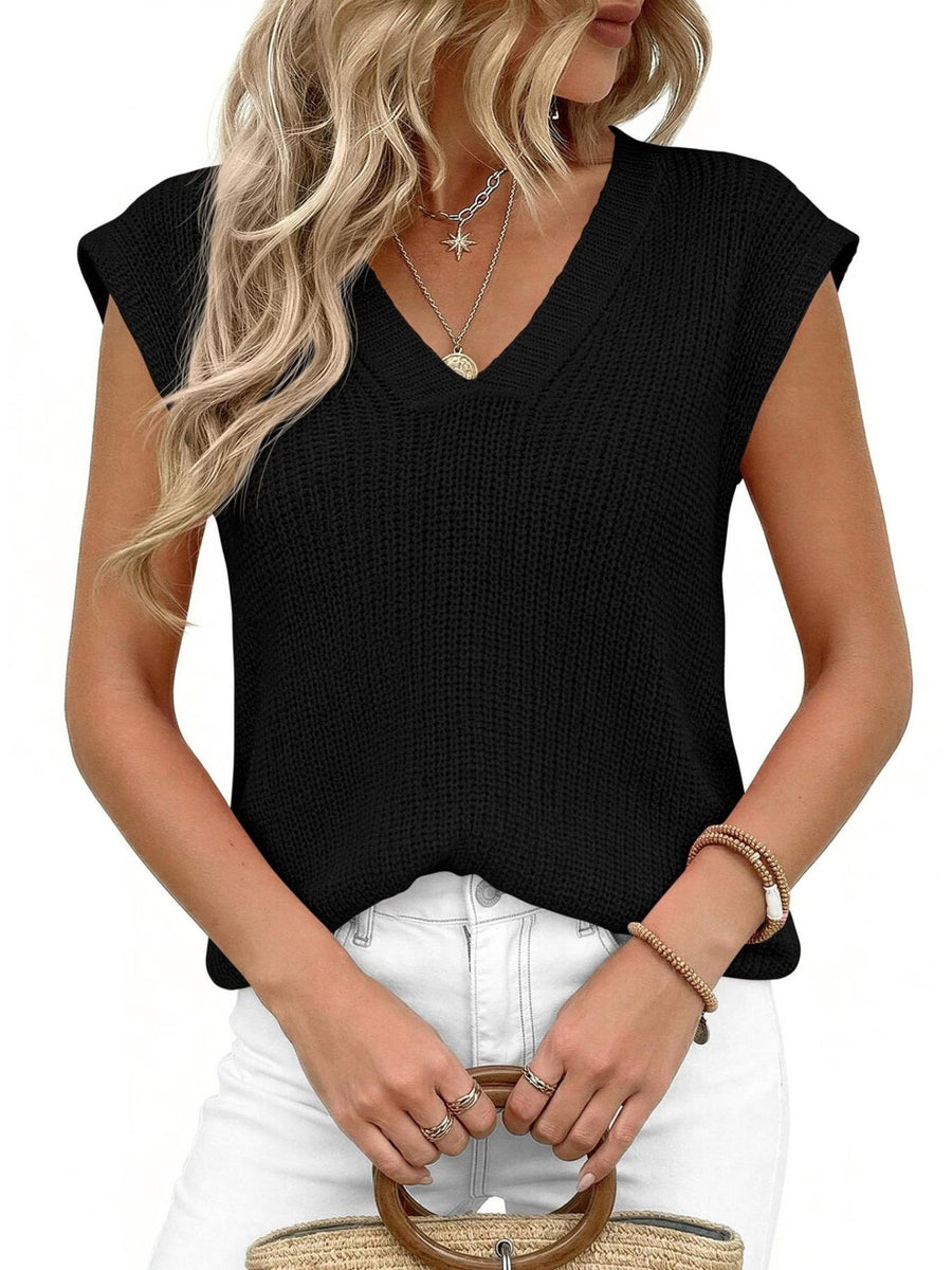 Black textured V-neck sweater vest with cap sleeves, styled with necklaces and bracelets.