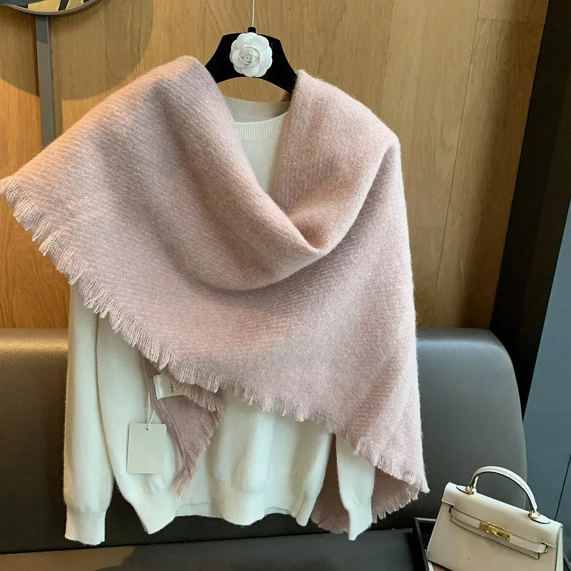 Dusty pink fuzzy triangle shawl scarf with fringe detail, styled over a cream sweater.