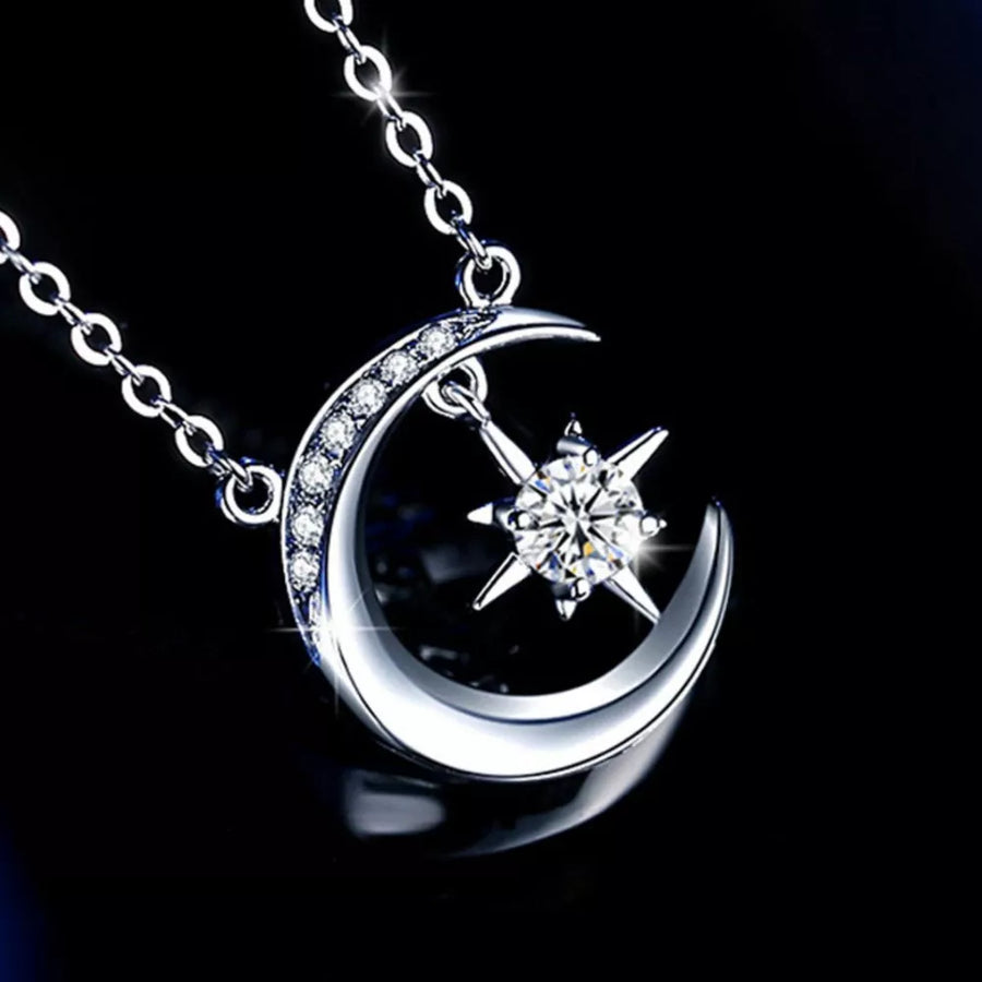 Celestial moissanite crescent necklace with star charm, silver tone, delicate chain.