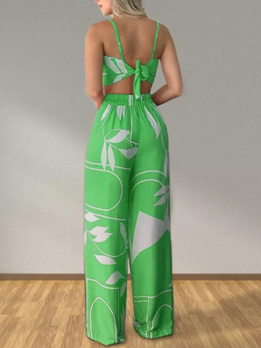 Light green tropical print crop top and wide-leg pants set with tie back detail.