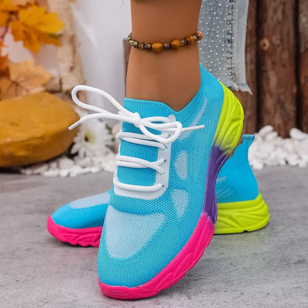 Breathable mesh lace-up sneakers in sky blue with pink, purple, and neon green accents.