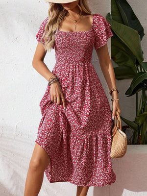 Red floral smocked midi dress with ruffle sleeves and square neckline.