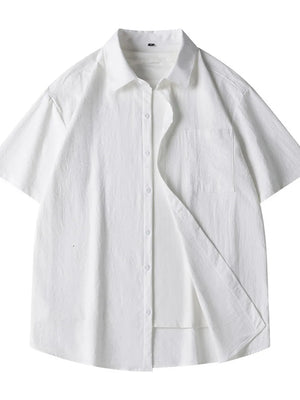 White relaxed fit button-up shirt with short sleeves and chest pocket.