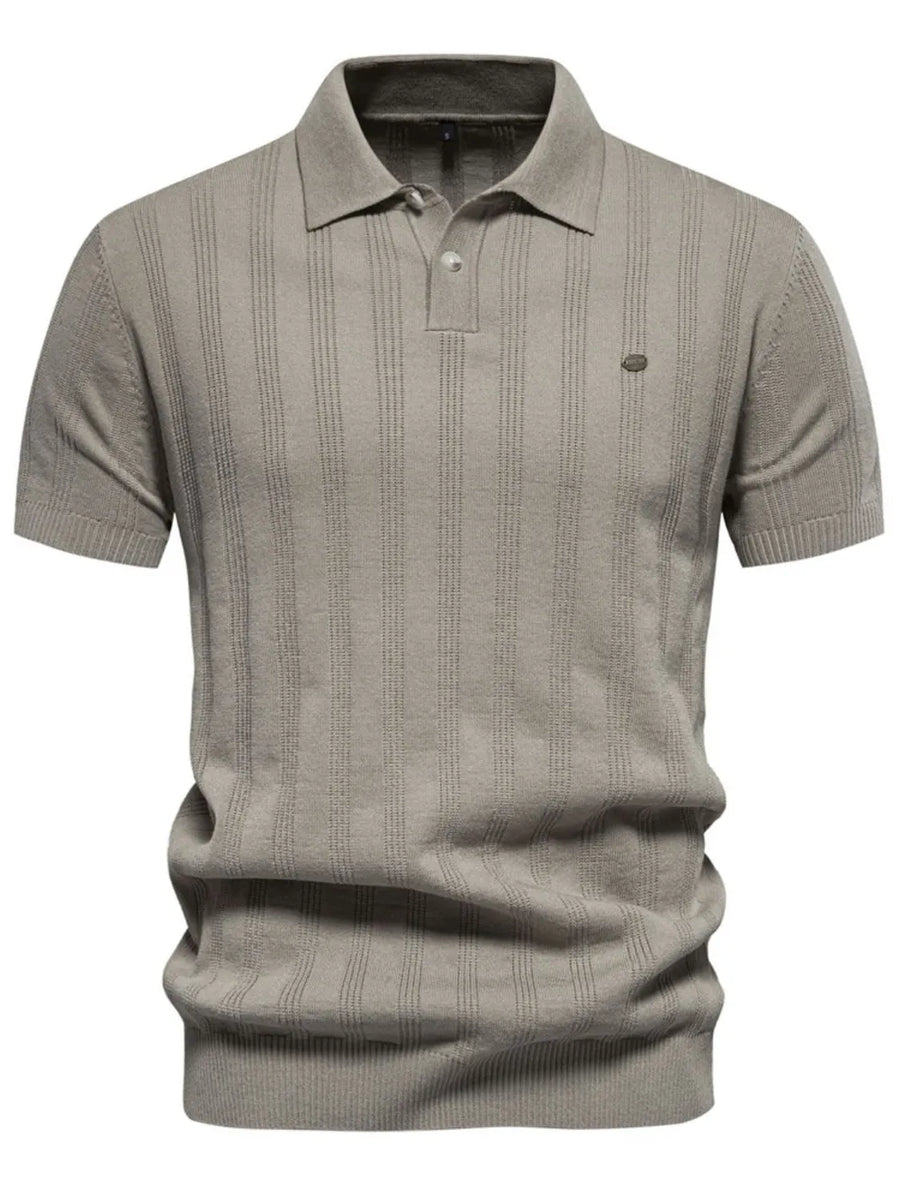 Beige textured ribbed knit polo shirt with short sleeves and a button placket.