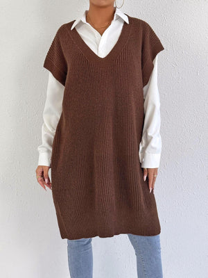 100% polyester Care instructions: Machine wash cold sweater vest in Black with oversized silhouette