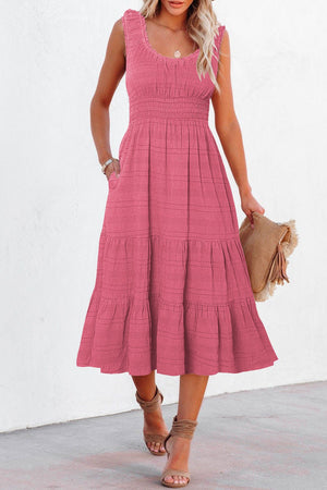 Pocketed smocked midi dress in deep rose with tiered skirt and ruffled neckline.