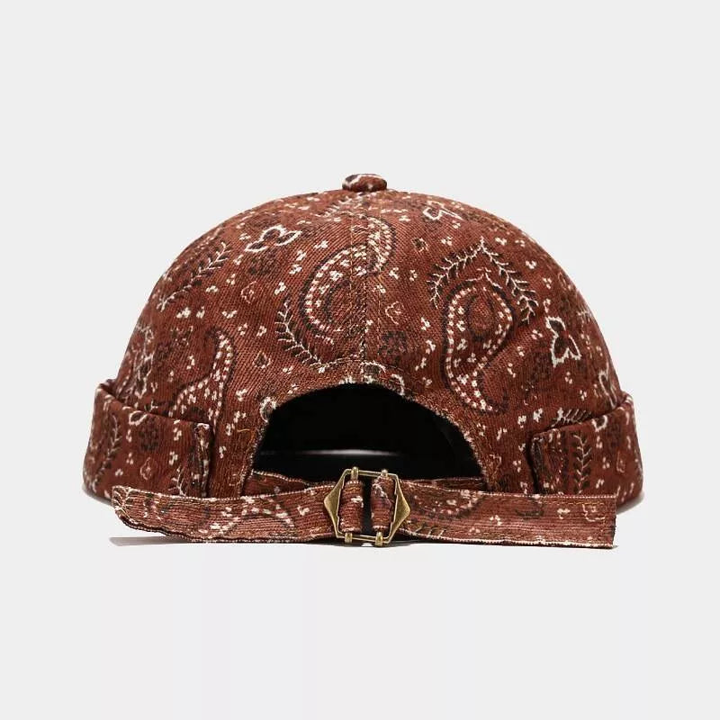rust brown hat featuring adjustable strap and paisley