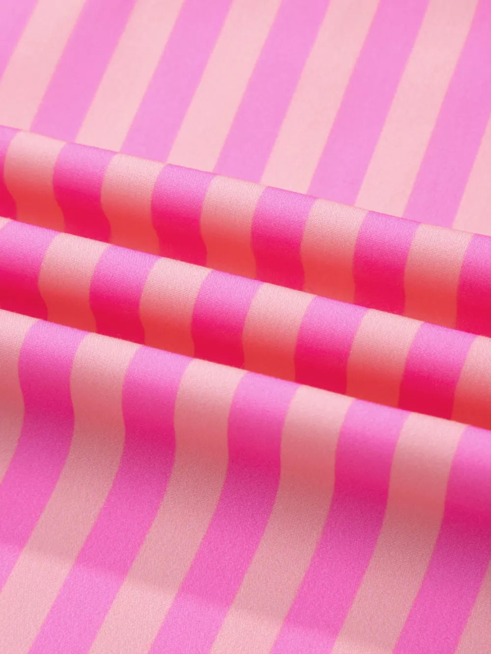 Vibrant stripe ruffled neck summer blouse with cap sleeves in pink and light pink.