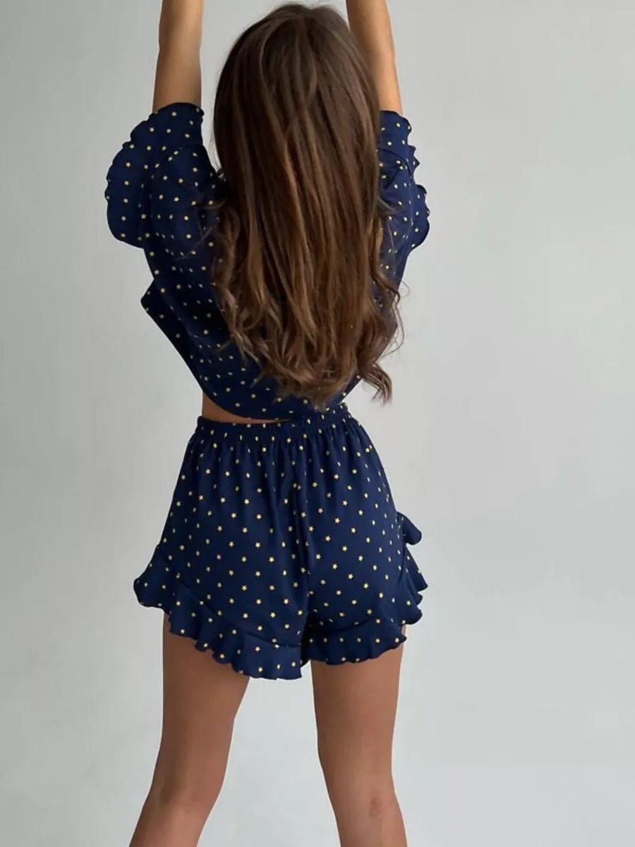 Blue star-print pajama set with ruffled crop top and shorts.