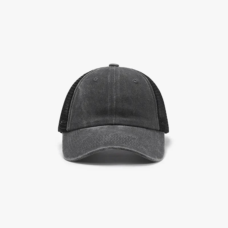Dark gray vintage wash trucker hat with black mesh back.