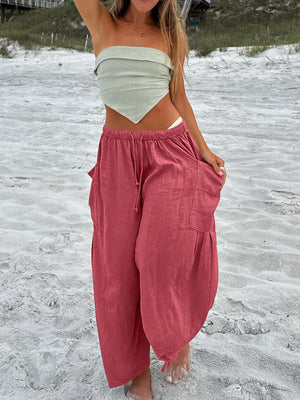 Linen balloon pants in strawberry with sculptural pocket detail and drawstring waist.