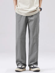 Men's casual grey wide-leg sweatpants with a relaxed fit and subtle logo detail.