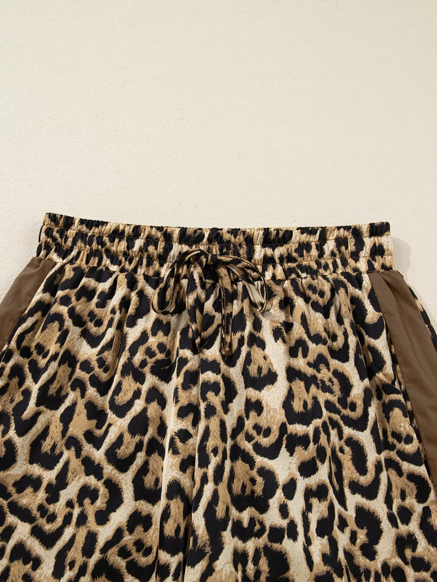 Leopard print two-piece set with drawstring waist and brown side panels.