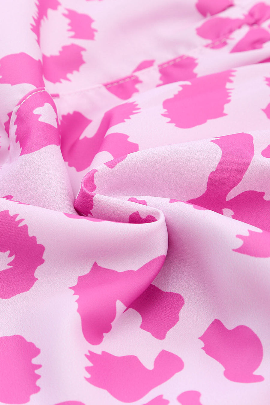 Pink leopard print shorts with scalloped hem detail