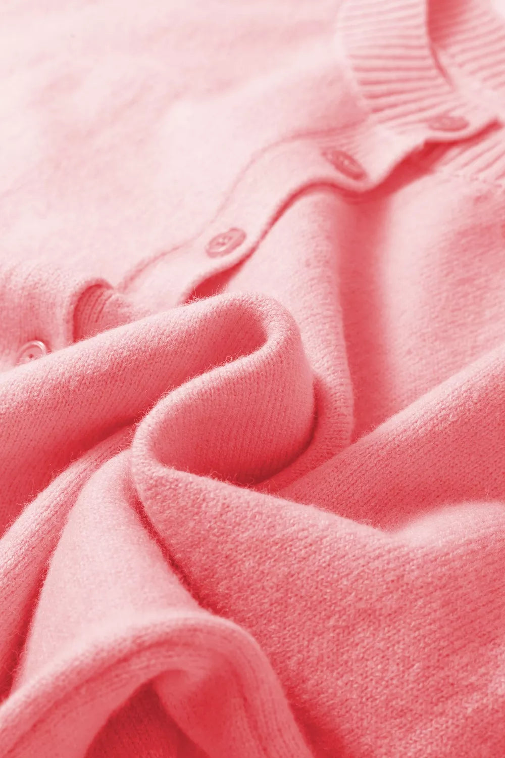 Pink acrylic knit cardigan with button front detail