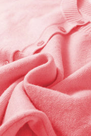 Pink acrylic knit cardigan with button front detail