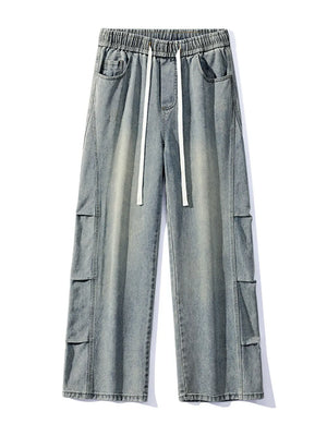 Light wash denim cargo jeans with elastic waist and drawstring.