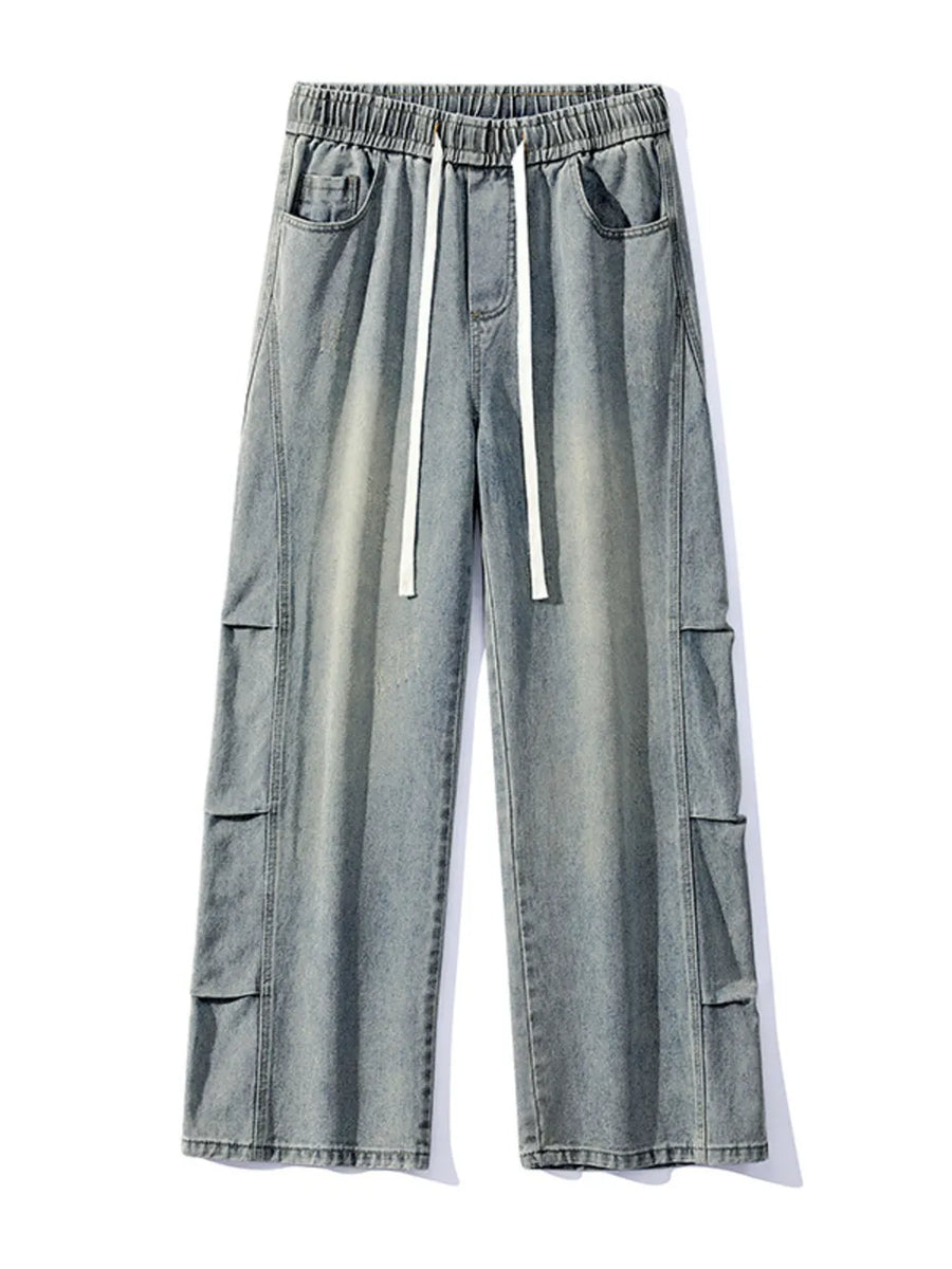 Light wash denim cargo jeans with elastic waist and drawstring.