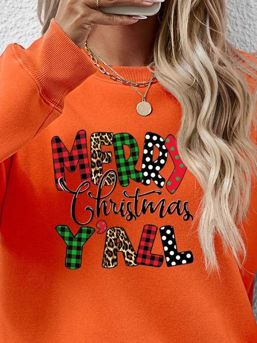 Orange graphic sweatshirt with Merry Christmas Yall text in mixed prints: plaid, leopard, polka dot